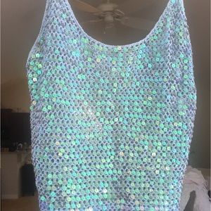 Blue sleeveless knit top, front covered with sequins, back blue knit.